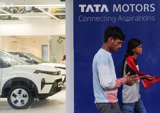 People walk past Tata Motors written outside its showroom in New Delhi, India, September 18, 2026. REUTERS/Sahiba Chawdhary