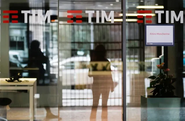FILE PHOTO: The Tim logo is seen at its headquarters in Rome, Italy November 22, 2021.