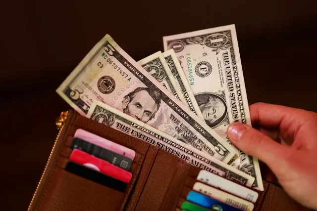 FILE PHOTO: U.S. dollar banknotes are seen in this illustration taken March 24, 2026.