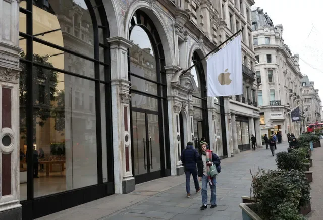People walk past an Apple store in London, Britain, January 13, 2025. REUTERS/Isabel Infantes