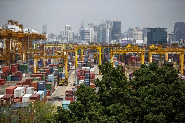 Shipping containers stand at a port in Bangkok March 30, 2015. REUTERS/Athit Perawongmetha