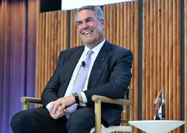 General Motors President Mark Reuss smiles at the start of his conversation with Automotive News Publisher KC Crain, out of view, on Tuesday, Sept. 29, 2026, at the Department at Hudson’s in Detroit. Reuss said the automaker is committed to EVs despite changes in U.S. regulations.
