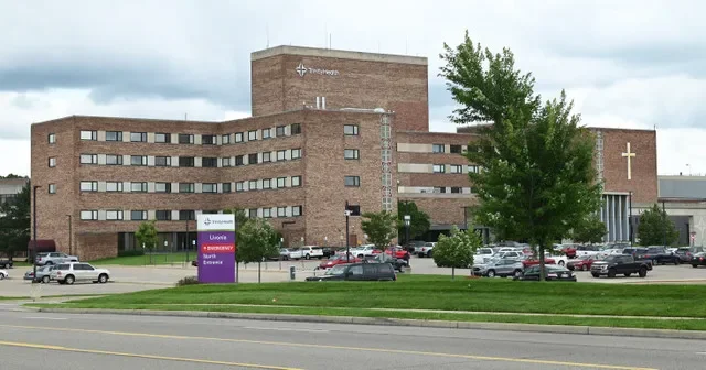 Exterior of Trinity Health Hospital in Livonia on July 29, 2023. The health system is laying off 577 employees starting in October 2026.