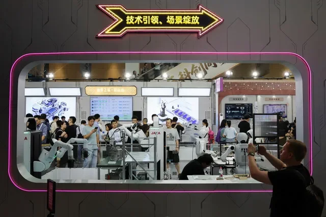 People visit the World Artificial Intelligence Conference (WAIC) in Shanghai, China, July 17, 2026. REUTERS/Go Nakamura