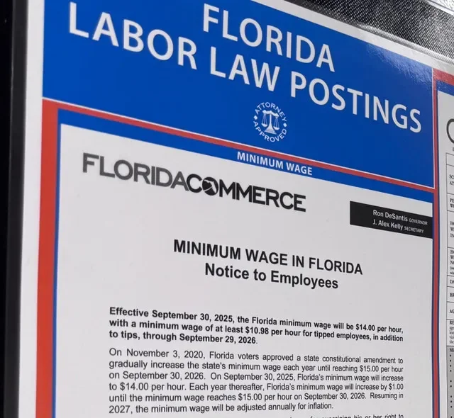 A sign announcing Florida's minimum wage is increasing a dollar to $15 an hour on Sept. 30, 2026, is displayed inside the Homesense home furnishing store in Daytona Beach on Sept. 13. Homesense is part of the same company that owns HomeGoods, Marshalls and HomeGoods.
