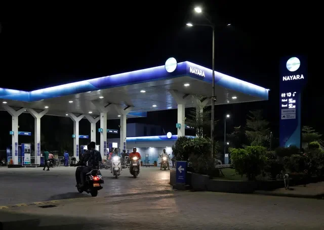Scooterists leave after filling oil at a fuel station of Nayara Energy on the outskirts of Ahmedabad, India, November 15, 2022. REUTERS/Amit Dave