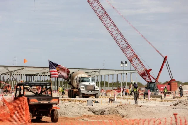 FILE PHOTO: The steel frame of data centers under construction during a tour of the OpenAI data center in Abilene, Texas, U.S., September 23, 2025. REUTERS/Shelby Tauber/File Photo