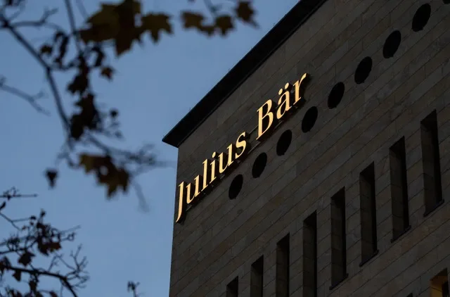 FILE PHOTO: A logo is pictured on Swiss private bank Julius Baer building in Geneva, Switzerland, November 21, 2024. REUTERS/Denis Balibouse/File Photo