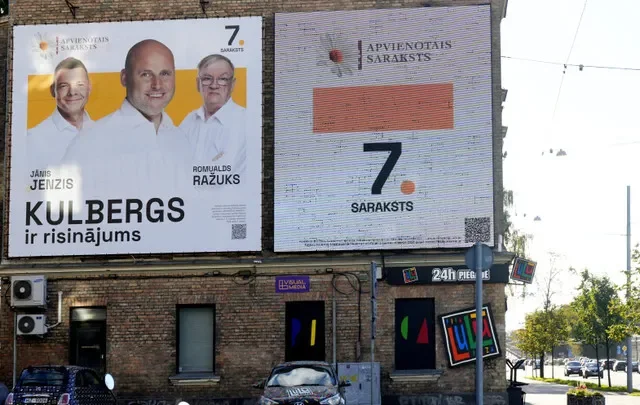 "Unites List" election campaign poster featuring Prime Minister Andris Kulbergs before the general election in Riga, Latvia, September 27, 2026. Sign reads "Kulbergs is the solution". REUTERS/Ints Kalnins