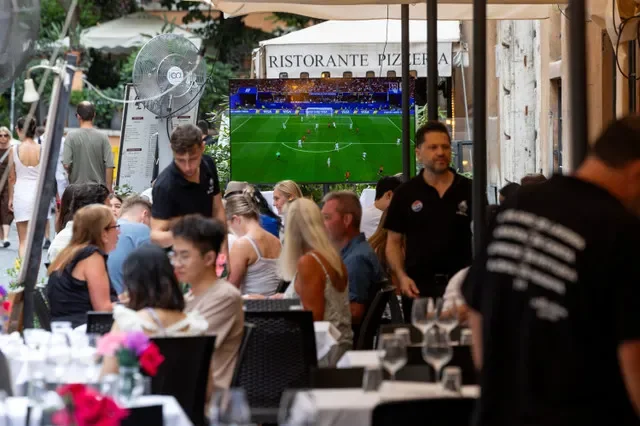 People sit at outdoor tables at a restaurant, in downtown Rome, Italy, June 15, 2026. REUTERS/Remo Casilli