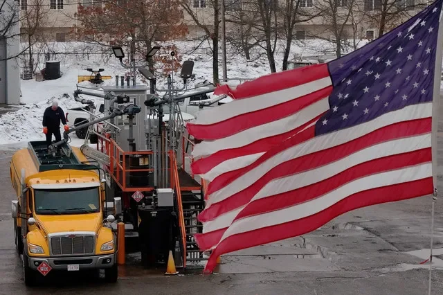 FILE PHOTO: A drone view shows an oilman filling his home heating oil delivery truck in Danvers, Massachusetts, U.S., March 6, 2026. REUTERS/Brian Snyder/ File Photo
