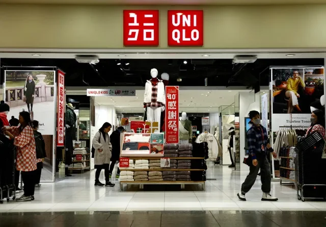 Shoppers look around for clothes at a Fast Retailing's Uniqlo store in Tokyo, Japan November 26, 2024. REUTERS/Issei Kato
