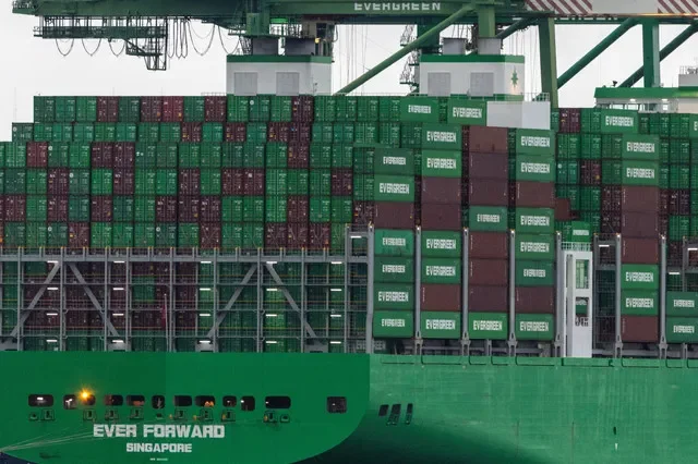 FILE PHOTO: Shipping containers are stacked on a cargo ship at the port of Oakland in Oakland, California, U.S., February 24, 2026. REUTERS/Carlos Barria/File Photo