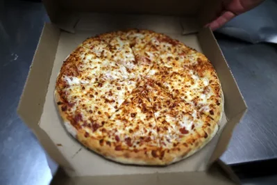 Dominos Lowers Annual Sales Outlook