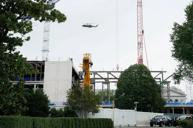 Marine One, carrying US President Donald Trump, flies over the construction site of the White House ballroom in Washington, DC, US, October 10, 2026. REUTERS/Elizabeth Frantz