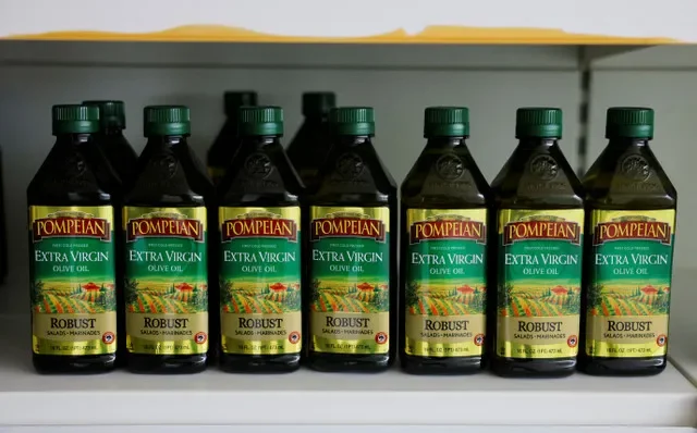 FILE PHOTO: Bottles of extra virgin olive oil of the Pompeian brand, which are exported to the U.S, sit at the factory of the Spanish olive oil producer Dcoop, in Antequera, Spain, April 9, 2025, REUTERS/Jon Nazca/File Photo