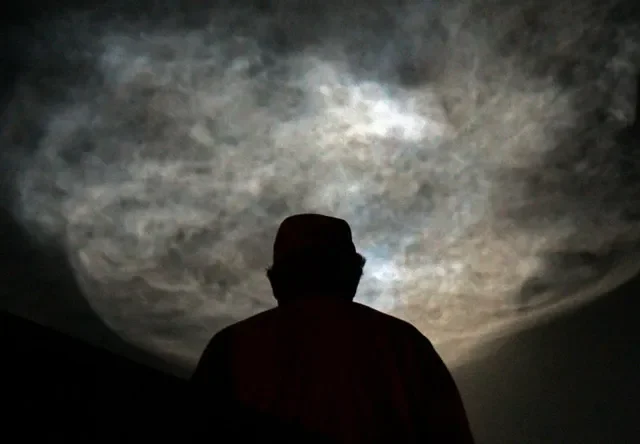 Steve Holmes of Viera watches the magnificent "jellyfish" that lingered in the sky after the Oct.13 launch of the SpaceX CRS-35 resupply mission.