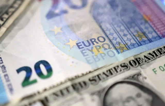 Euro and U.S. dollar banknotes are seen in this illustration taken May 4, 2025. REUTERS/Dado Ruvic/Illustration
