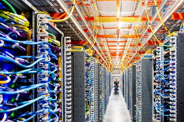 FILE PHOTO: A technician works at an Amazon Web Services AI data center in New Carlisle, Indiana, U.S., October 2, 2025. REUTERS/Noah Berger for AWS/File Photo