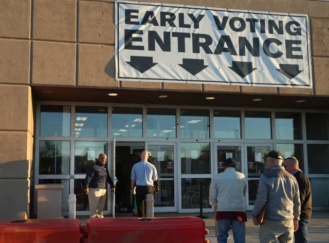 Franklin County Board of Elections director Anton White opens the door for people as voters cast their ballots for the Nov. 3 election as early in-person voting begins.