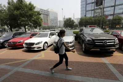 China domestic passenger vehicle sales are expected to decline sharply in 2026 before staging a modest two percent recovery in 2027. Industry official Cui Dongshu notes that easing cost pressures and better products will support the rebound despite intense competition.