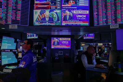 Wall Street Rises as Fed Holds Rates Steady