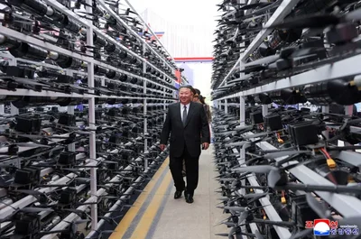 North Korean leader Kim Jong Un called for absolute superiority in drone technology and artificial intelligence during a military exhibition. The display featured tactical suicide drones and missiles as border tensions with South Korea escalate.